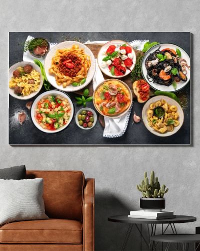 Italian food dishes on dark background. Traditional food concept. Top view.