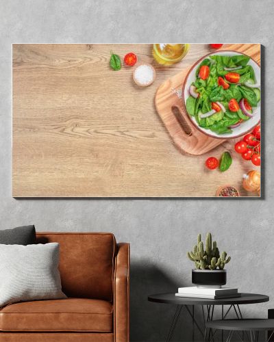 Green salad vegan leaves tomato salad on a wooden table. Long banner format. top view. copy space.