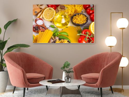 Various pasta with spices and ingredients for cooking. Preparation dinner, lunch background with fresh basil, tomatoes, spices, garlic and different sort and types of italian Mediterranean pasta