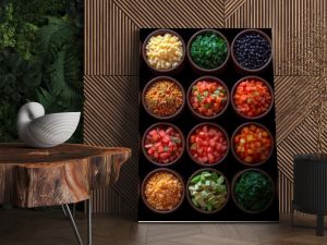 colorful spices, legumes, and foods in small bowls on a black surface