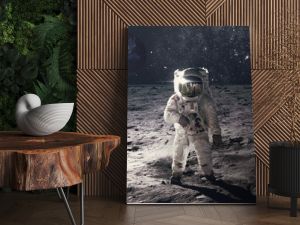 Astronaut on rock surface with space background. Elements of this image furnished by NASA