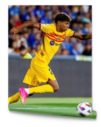 Madrid, Spain- August 13, 2023: Soccer match between Getafe FC and Barcelona FC of the Spanish EA Sports league. Lamine Yamal with the ball. Football players.