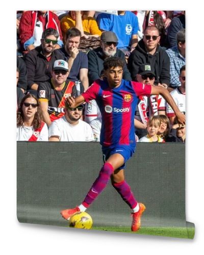 Madrid, Spain- November 25, 2023: League match between Rayo Vallecano and F.C Barcelona in Madrid. Lamine Yamal with the ball. Football players.