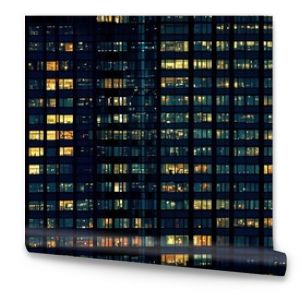 Seamless pattern of skycraper or office building windows at night - tiles, texture