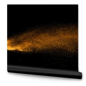 Closeup of orange powder particle splash isolated on black  background.