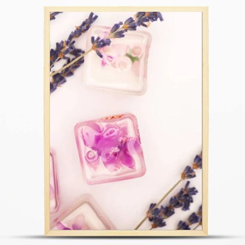 top view of frozen lavender flowers near twigs on white background
