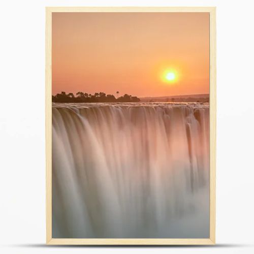 Beautiful sunrise over waterfall