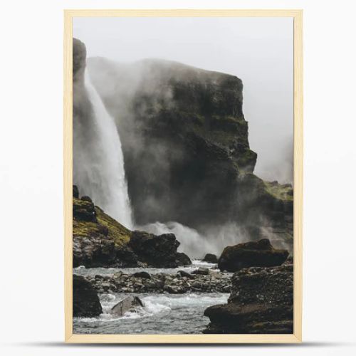 beautiful icelandic landscape with Haifoss waterfall on misty day