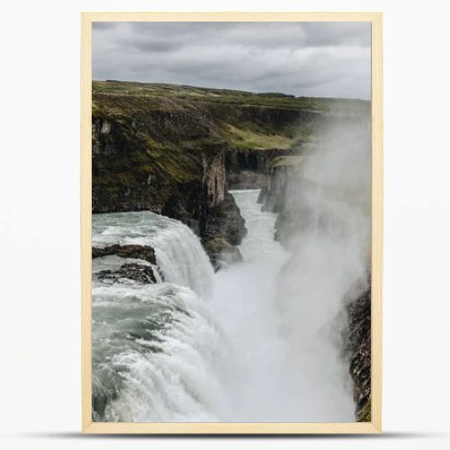 scenic view of steam above beautiful Gullfoss waterfall  flowing through highlands in Iceland