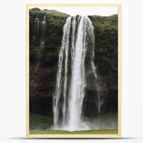 scenic view of beautiful Seljalandsfoss waterfall in highlands in Iceland 