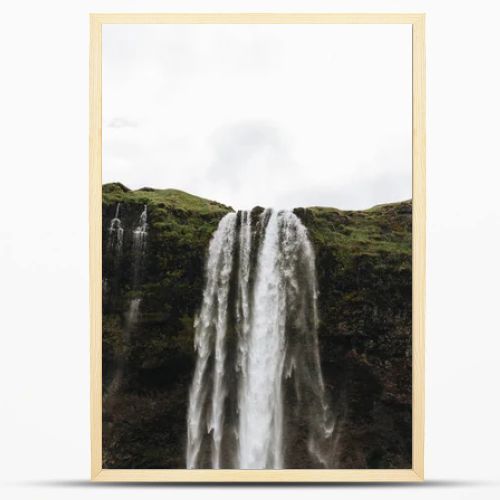 low angle view of Seljalandsfoss waterfall in highlands in Iceland 