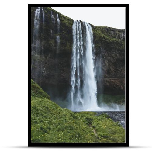 scenic view of landscape with Seljalandsfoss waterfall in highlands in Iceland 