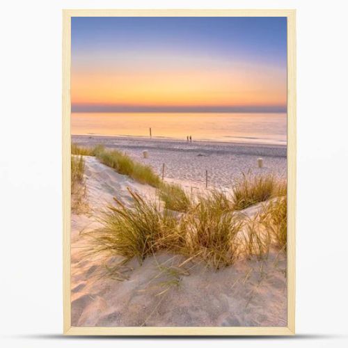 Sunset View over ocean from dune over North Sea and Canal in Ouddorp, Zeeland Province, the Netherlands. Outdoor scene of coast in nature of Europe.