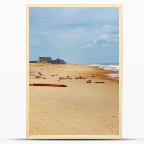 Empty ocean shoreline with cloudy sky and dunes Atlantic coast North Carolina USA