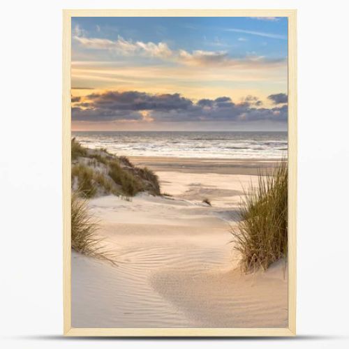 View from dune top over sunset in North Sea from the island of Ameland, Friesland, Netherlands