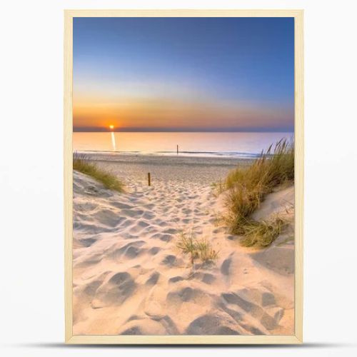 Inviting Sunset View over ocean from dune over North Sea and Canal in Ouddorp, Zeeland Province, the Netherlands. Outdoor scene of coast in nature of Europe.