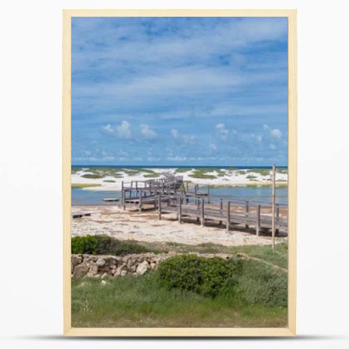 Coastal Wetland Landscape With Wooden Walkway And Sand Dunes in Mari Ermi Cabras