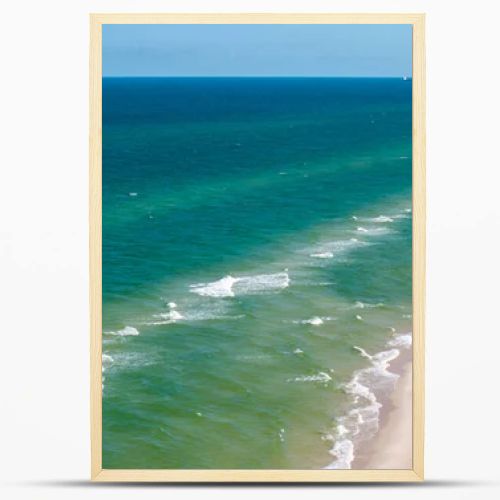 Aerial drone view of long sandy beach and green Baltic Sea coastline with pine forest  summer coastal landscape photography