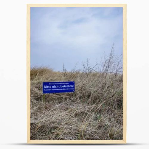 Norddeich, Germany.  March 24, 2026. Landscape scene at the Northsea coast in East Frisia. Lettering in German which means -Probibited to walk on the dunes- . Editorial and documentary use only