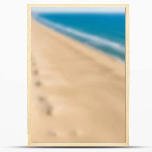 Aerial drone view of a vast, empty sandy beach with gentle ocean waves and a clear blue sky.