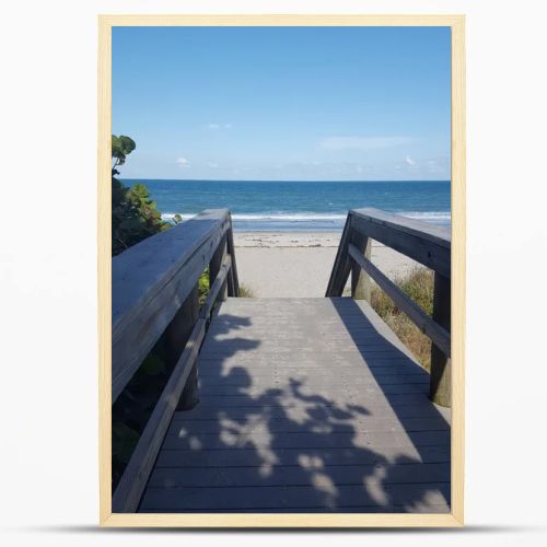 Wooden Boardwalk Path Leading to Sandy Beach and Atlantic Ocean