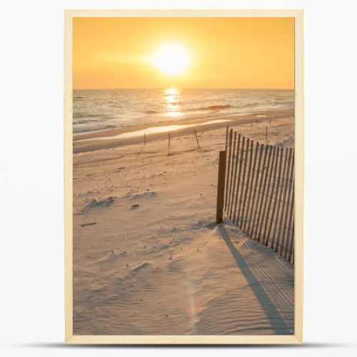 Beautiful Sunset Over the Ocean with Sand Fencing