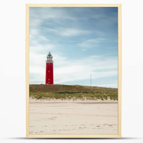 Lighthouse at Texel Netherlands in seashore landscape