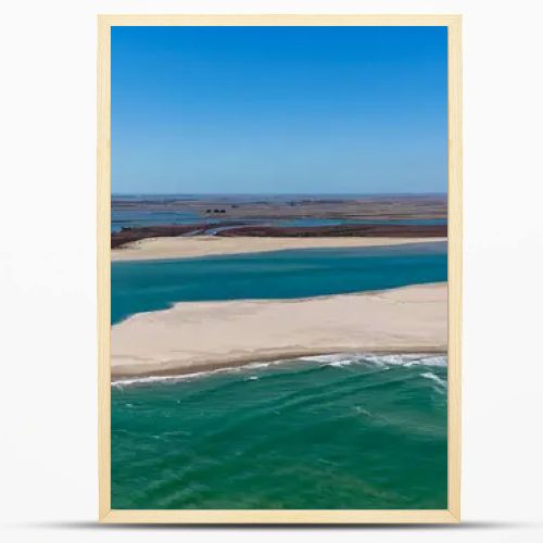 Coorong National Park in South Australia is a coastal wilderness renowned for its vast lagoon system, sand dunes, and pristine natural beauty. This aerial drone footage captures the striking contrast between turquoise waters, winding estuarine