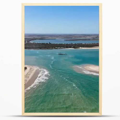 Coorong National Park in South Australia is a coastal wilderness renowned for its vast lagoon system, sand dunes, and pristine natural beauty. This aerial drone footage captures the striking contrast between turquoise waters, winding estuarine