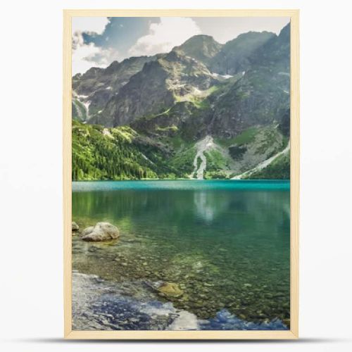 Crystal clear mountain lake and rocky mountains