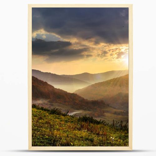 cold fog in mountains at sunset