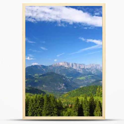 Scenic view of mountains, forests and blue sky