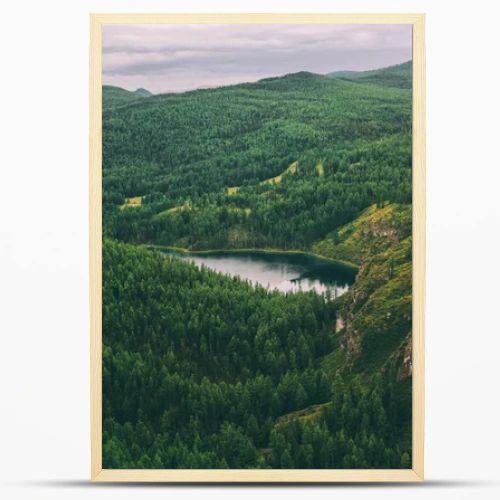 majestic mountains covered with trees and beautiful mountain lake in Altai, Russia