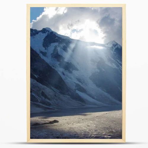 mountains and cloudy sky with sunlight