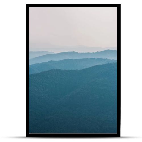 scenic and blue silhouette of mountains outside 