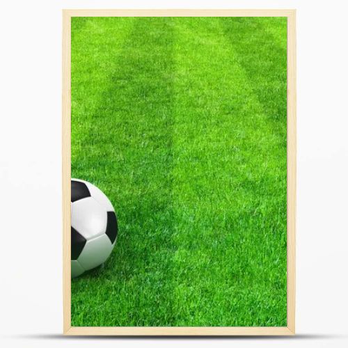 Green striped football field with soccer ball