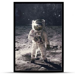 Astronaut on rock surface with space background. Elements of this image furnished by NASA