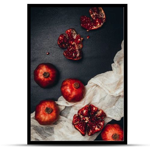 flat lay with gauze and fresh garnets arrangement on black tabletop