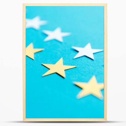 close up of white and yellow stars on blue 