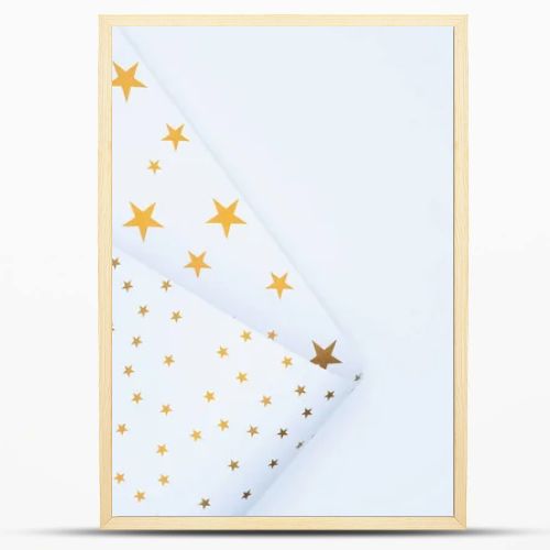 view from above of festive paper decorated by golden stars isolated on white 