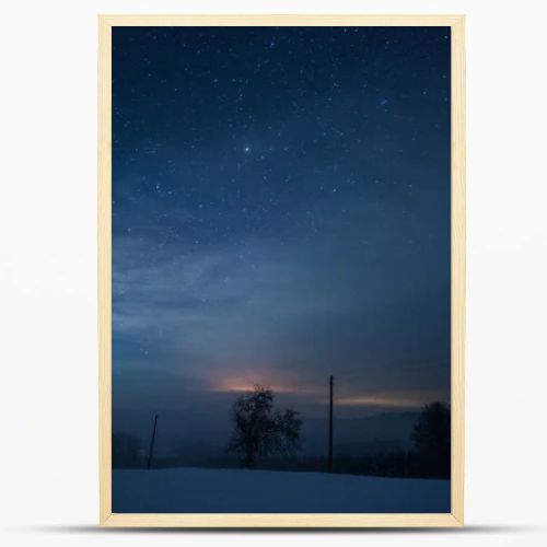 starry dark sky in carpathian mountains at night in winter