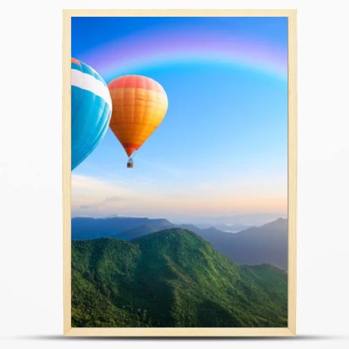 Colorful hot-air balloons flying over the mountain