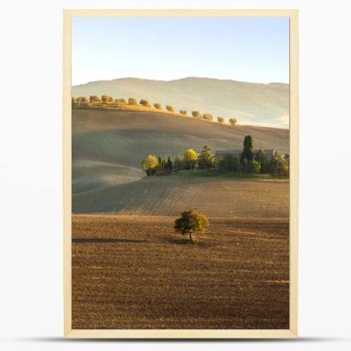 The setting sun over the valley of the Orcia in Tuscany, Italy