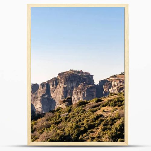 rock formations with monastery near mountains in meteora 