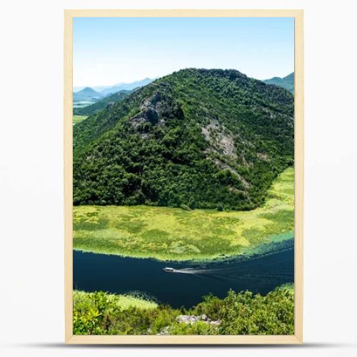 landscape of blue curved Crnojevica River and mountains in Montenegro