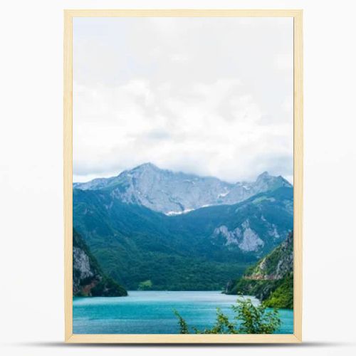 beautiful Piva Lake, mountains and cloudy sky in Montenegro