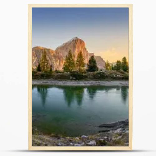 Panorama of the lake Lago di Limedes with the reflection of the surrounding mountains