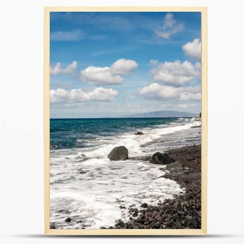 blue aegean sea near rocks against sky with clouds 