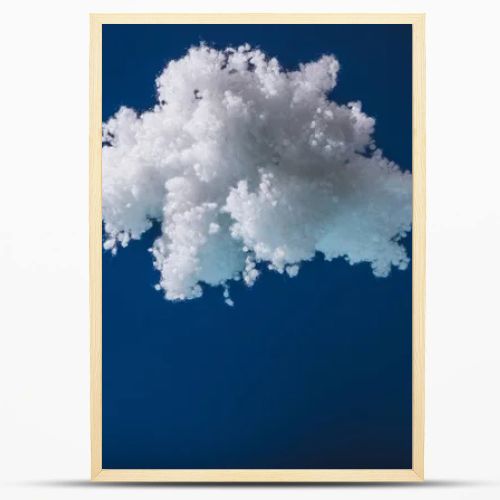 white fluffy cloud made of cotton wool isolated on dark blue