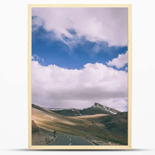 motorcyclist on mountain road in Indian Himalayas, Ladakh region